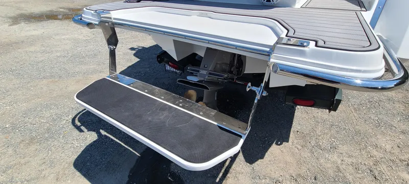 Slide: The Image of 2020 Cobalt R5 boat swim platform with foldable ladder on a sunny day. - 10