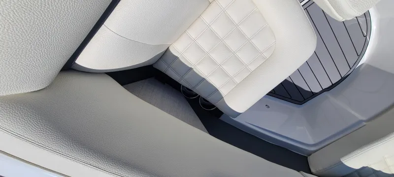 Slide: The Image of 2020 Cobalt R5 boat interior with white quilted seating and sleek design. - 17