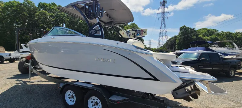 Slide: The Image of 2020 Cobalt R5 boat on trailer, parked outdoors under clear sky. - 2