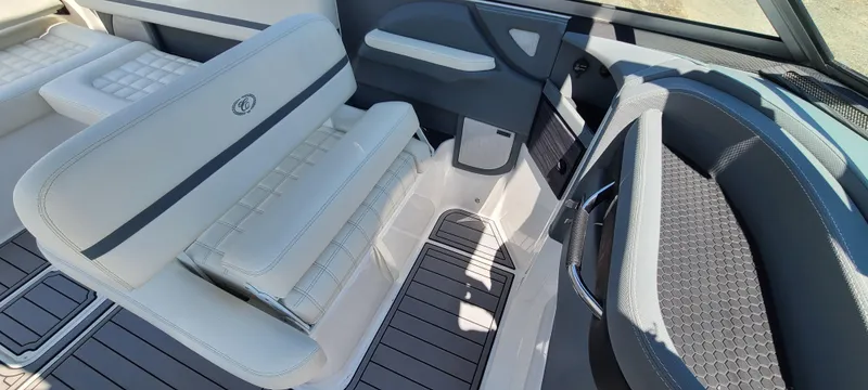 Slide: The Image of 2020 Cobalt R5 boat interior with white and gray seating, modern design. - 25