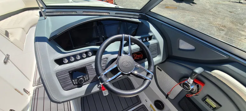 Slide: The Image of 2020 Cobalt R5 boat dashboard with steering wheel and control panel. - 28
