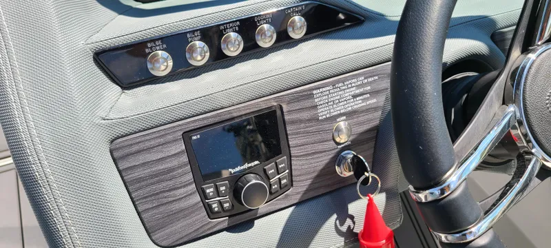Slide: The Image of Dashboard of a 2020 Cobalt R5 boat with control panel and steering wheel. - 29