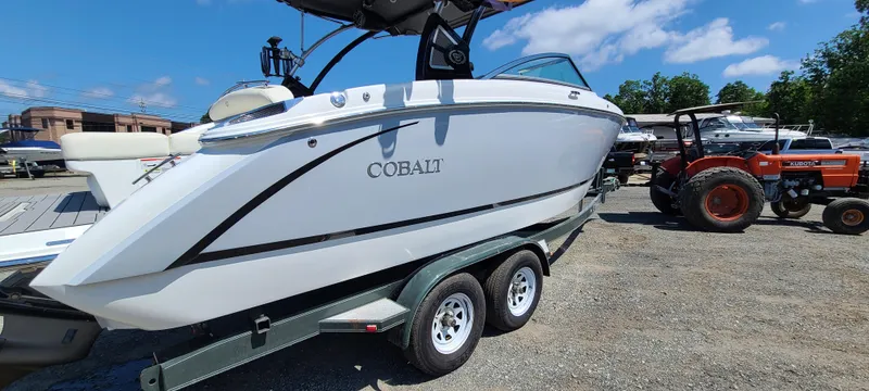Slide: The Image of 2020 Cobalt R5 boat on trailer, parked outdoors under blue sky. - 3