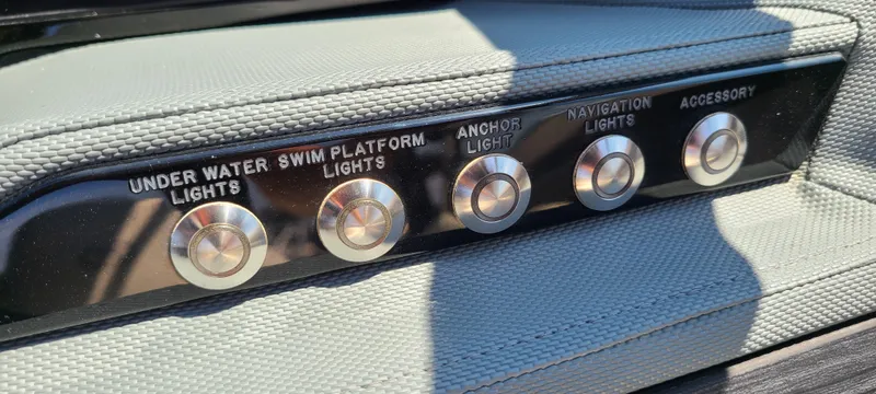 Slide: The Image of Control panel of a 2020 Cobalt R5 boat with labeled light switches. - 30