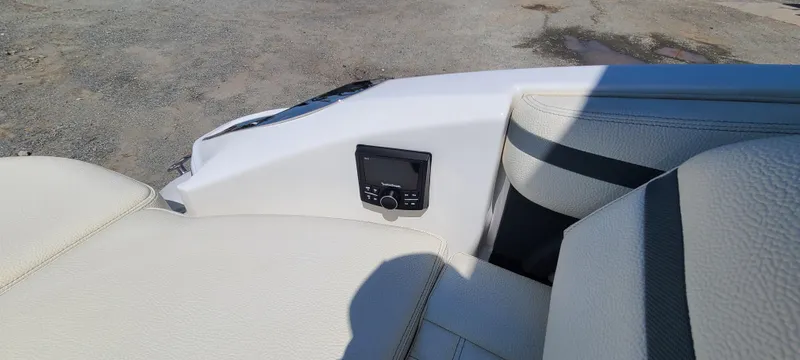 Slide: The Image of 2020 Cobalt R5 boat interior with beige seating and control panel. - 31