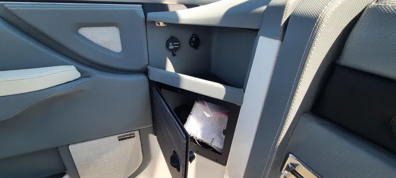 Slide: The Image of Interior of a 2020 Cobalt R5 boat, featuring storage compartments and sleek design. - 37