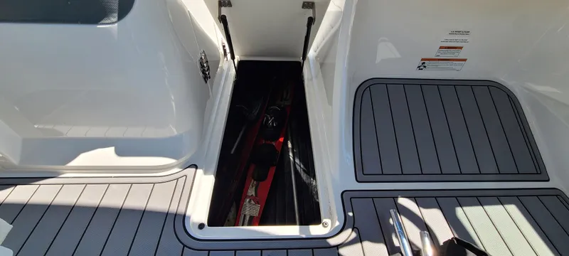 Slide: The Image of 2020 Cobalt R5 boat storage compartment with water skis inside. - 40