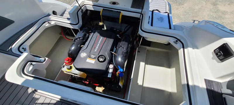 Slide: The Image of 2020 Cobalt R5 boat engine compartment with visible engine components. - 44