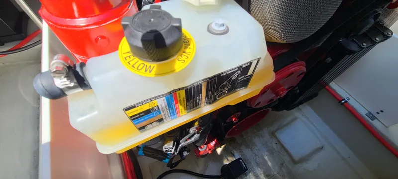 Slide: The Image of Coolant reservoir in a 2020 Cobalt R5 engine compartment. - 45