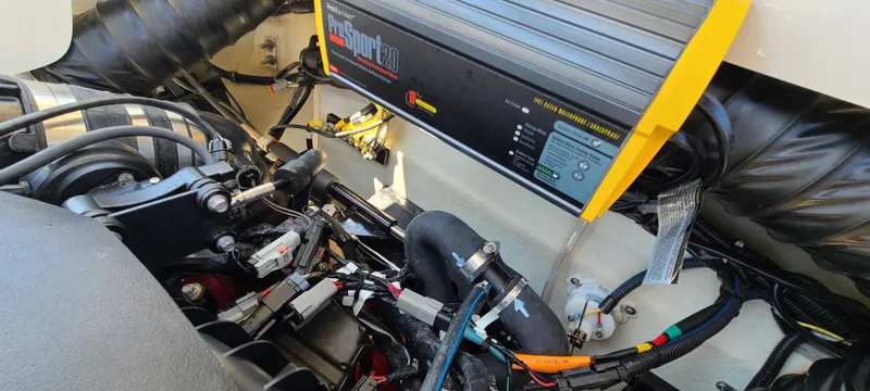 Slide: The Image of Engine compartment of a 2020 Cobalt R5 boat, showcasing wiring and components. - 46