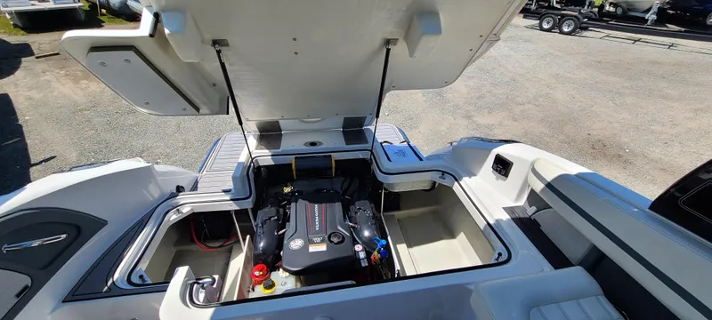 Slide: The Image of 2020 Cobalt R5 boat engine compartment with open hatch, showcasing engine details. - 47