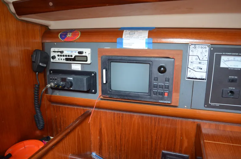 Slide: The Image of Control panel of a 1993 Beneteau Oceanis 370 sailboat with navigation equipment. - 11