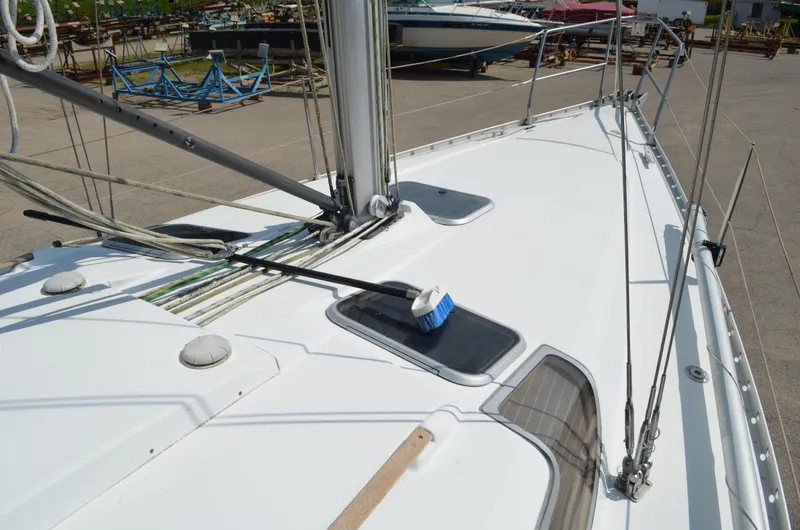 Slide: The Image of Deck of 1993 Beneteau Oceanis 370 sailboat, featuring clean lines and rigging details. - 4