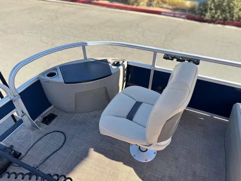 Slide: The Image of 2023 Sun Tracker Bass Buggy 18 DLX boat interior with seating and control panel. - 13