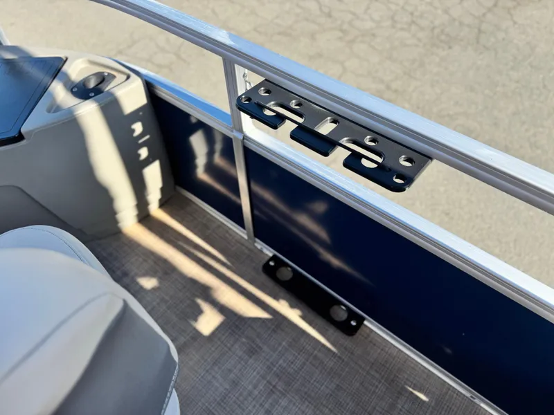 Slide: The Image of 2023 Sun Tracker Bass Buggy 18 DLX interior detail with railing and seating. - 14