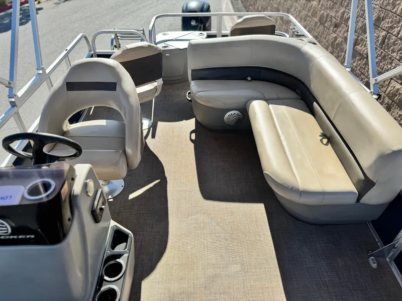 Slide: The Image of 2023 Sun Tracker Bass Buggy 18 DLX interior with seating and steering console. - 15
