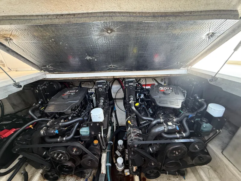 Slide: The Image of Engine compartment of a 2006 Sea Ray 290 Amberjack with twin 350 MAG engines. - 16