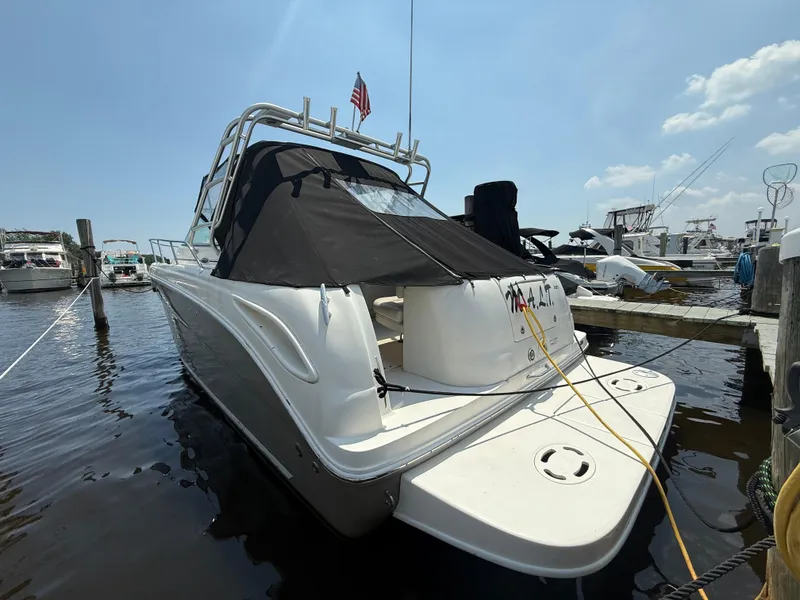 Slide: The Image of 2006 Sea Ray 290 Amberjack docked at marina under clear sky. - 31