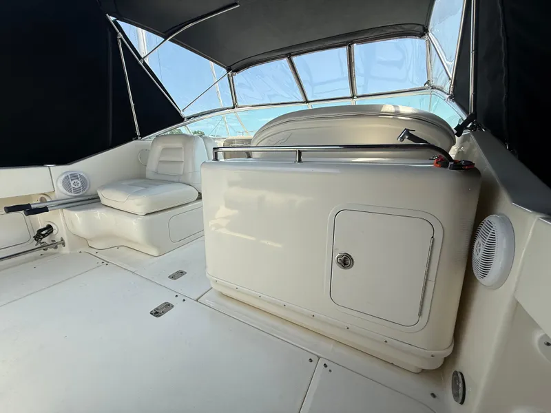 Slide: The Image of 2006 Sea Ray 290 Amberjack interior with seating and storage under canopy. - 6