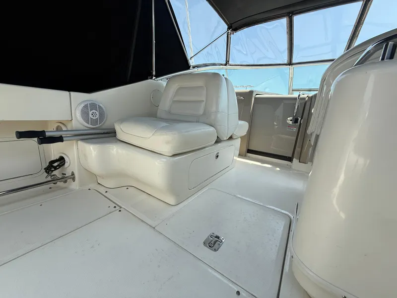 Slide: The Image of 2006 Sea Ray 290 Amberjack interior with white seating and modern design. - 8
