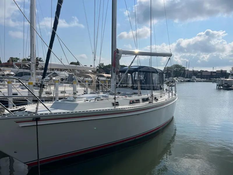 The Image of Sailboat Endeavour 45, 1992 model, docked at marina under blue sky. - 0