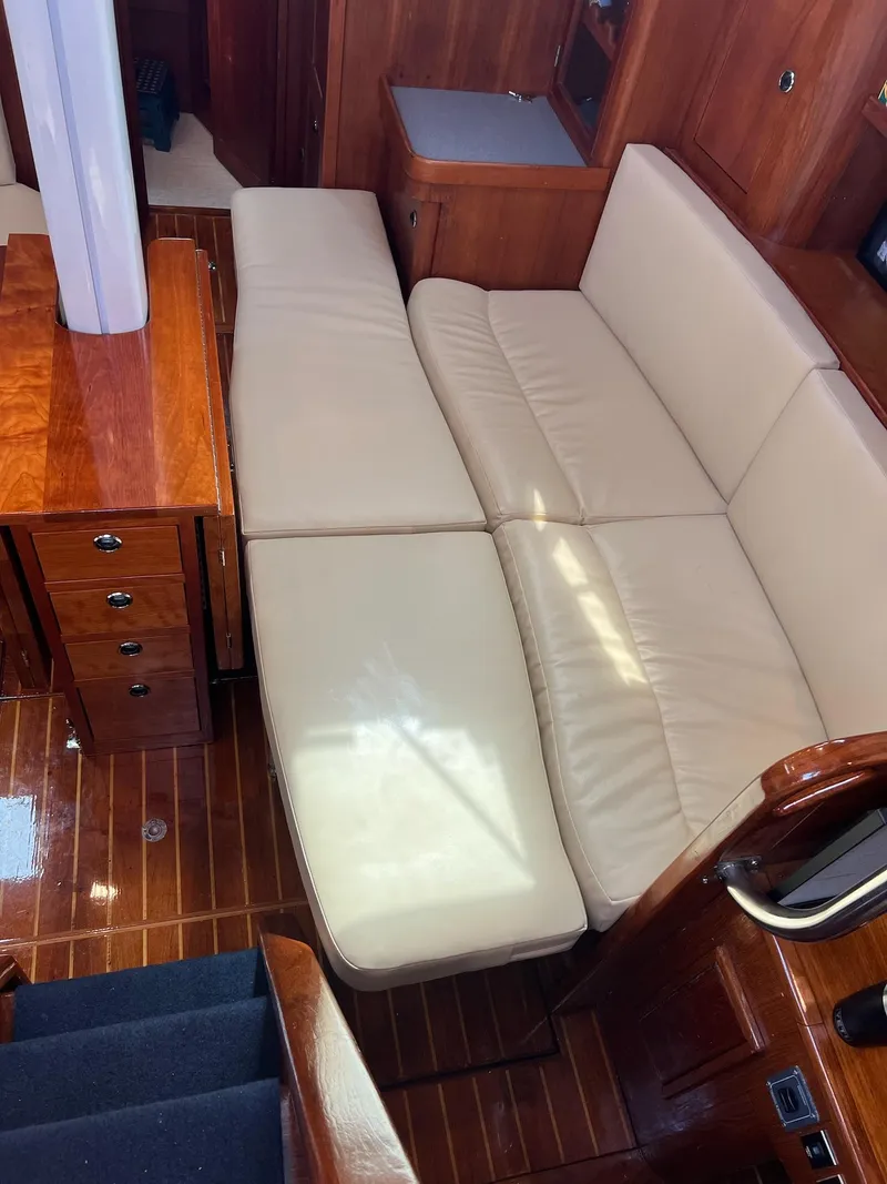 Slide: The Image of Luxurious interior of 1992 Endeavour 45 yacht with beige leather seating and wooden finishes. - 14