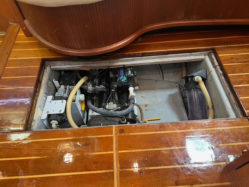 Slide: The Image of Engine compartment of a 1992 Endeavour 45 sailboat with wooden flooring. - 16