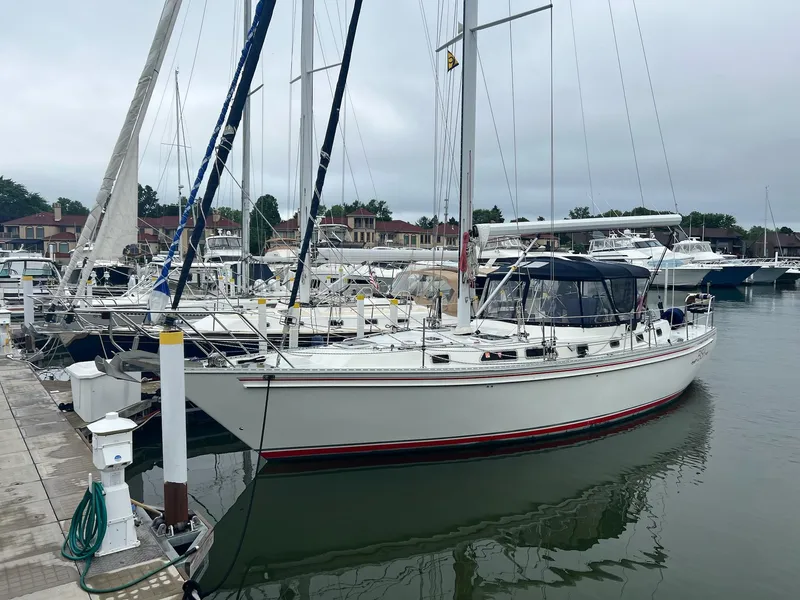 Slide: The Image of Sailboat Endeavour 45, 1992 model, docked at marina with other boats in background. - 2