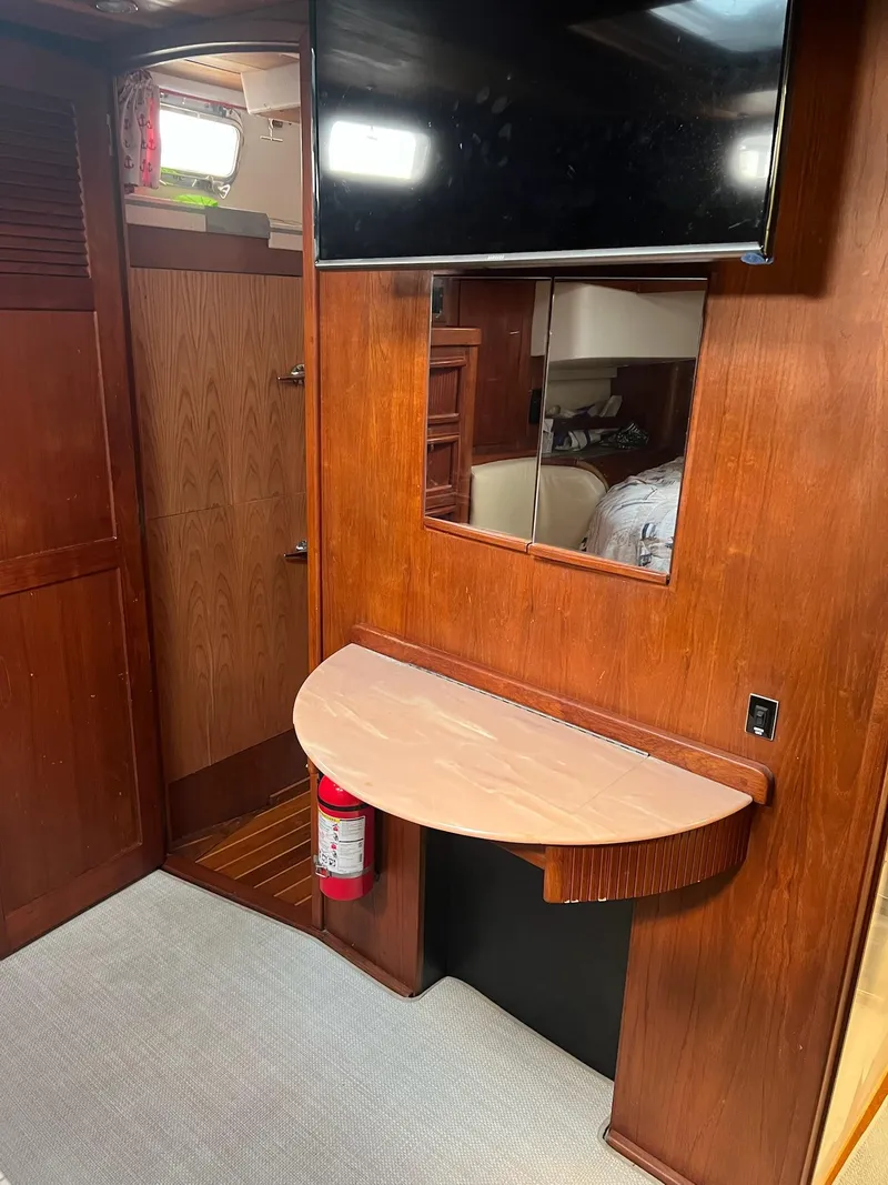 Slide: The Image of Interior of 1992 Endeavour 45 yacht with wooden cabinetry and mounted TV. - 20