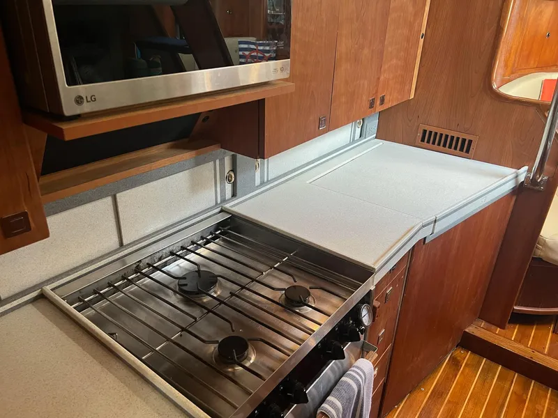 Slide: The Image of Galley kitchen in 1992 Endeavour 45 yacht with stove and microwave. - 21