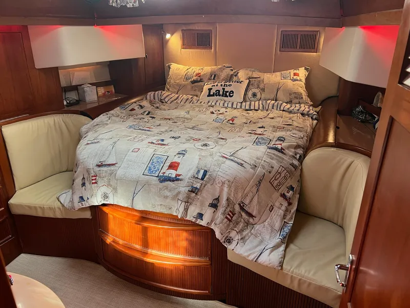 Slide: The Image of Cozy cabin interior of 1992 Endeavour 45 yacht with nautical-themed bedding. - 23