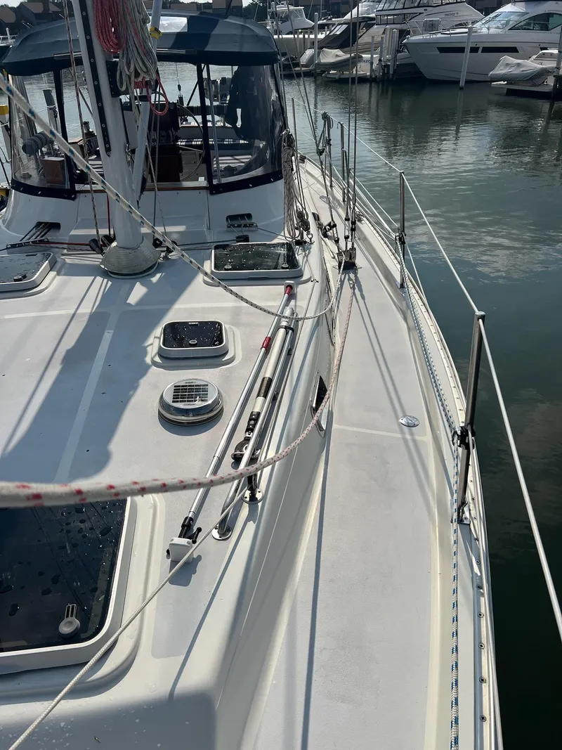 Slide: The Image of 1992 Endeavour 45 sailboat deck with rigging, docked at marina. - 3