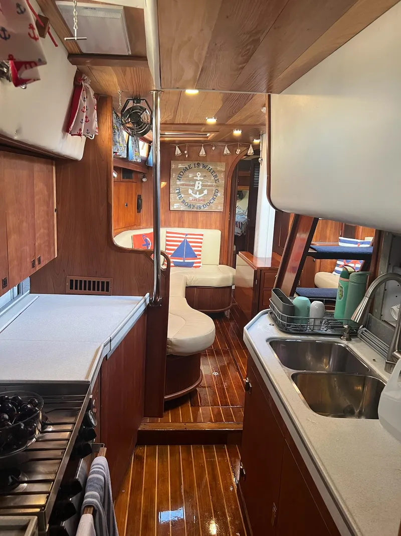 Slide: The Image of Interior of 1992 Endeavour 45 yacht with wooden finishes and cozy seating area. - 31