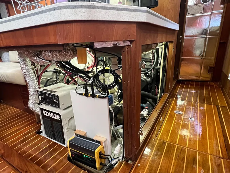 Slide: The Image of Engine room of 1992 Endeavour 45 yacht with Kohler generator and wooden flooring. - 33