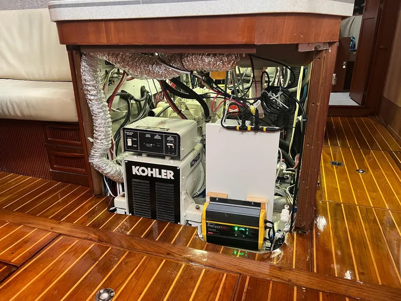 Slide: The Image of Engine compartment of a 1992 Endeavour 45 yacht with Kohler generator and wiring. - 35