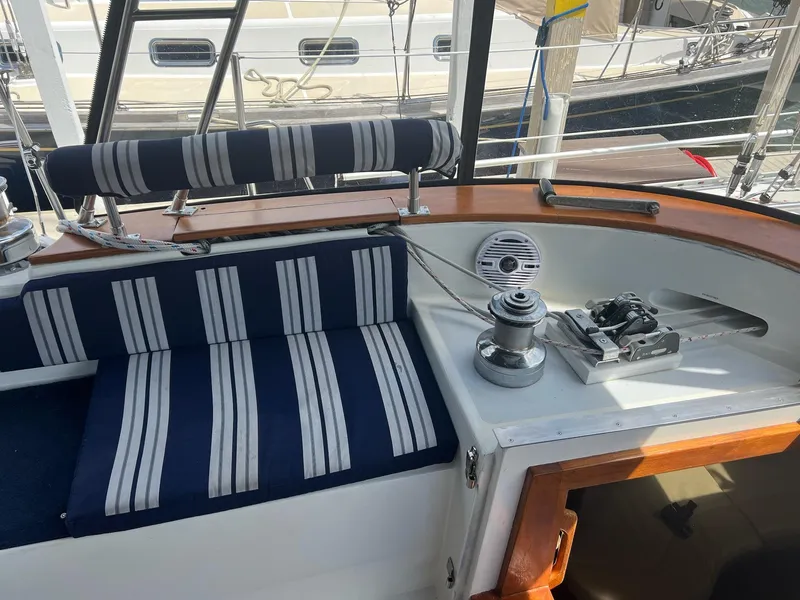 Slide: The Image of Cockpit of 1992 Endeavour 45 sailboat with striped cushions and winch. - 7