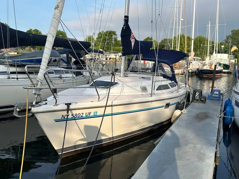 The Image of 1997 Catalina 28 MkII sailboat docked at marina, surrounded by other boats. - 0