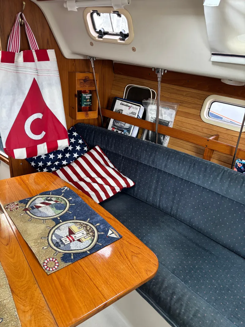 Slide: The Image of Interior of a 1997 Catalina 28 MkII sailboat with nautical decor and seating area. - 10