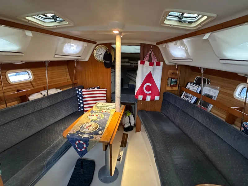 Slide: The Image of Interior of a 1997 Catalina 28 MkII sailboat with cozy seating and nautical decor. - 20