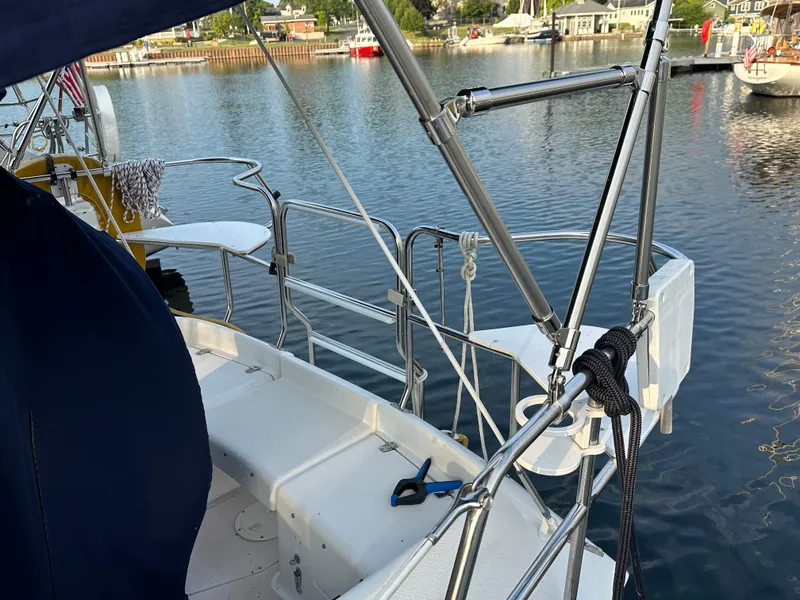 Slide: The Image of Cockpit view of a 1997 Catalina 28 MkII sailboat docked in a marina. - 3
