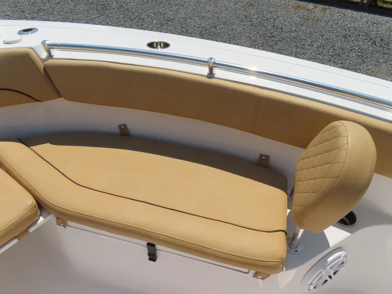 Slide: The Image of 2018 Sportsman Heritage 251 Center Console boat with tan cushioned seating. - 10