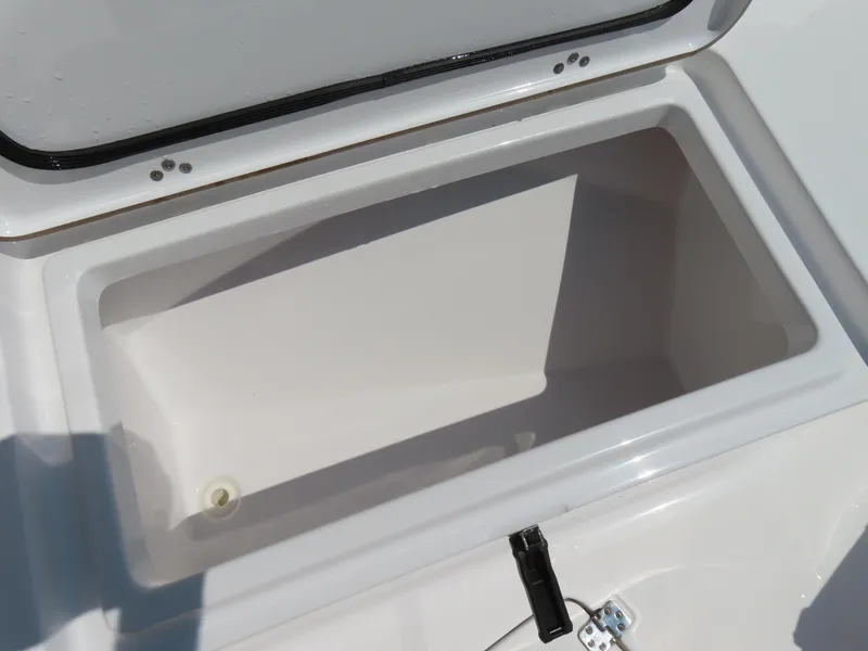 Slide: The Image of Open storage compartment on 2018 Sportsman Heritage 251 Center Console boat. - 15