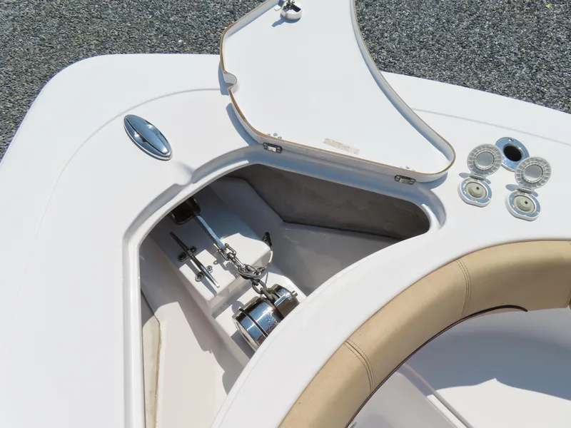 Slide: The Image of 2018 Sportsman Heritage 251 Center Console anchor compartment with open hatch. - 18