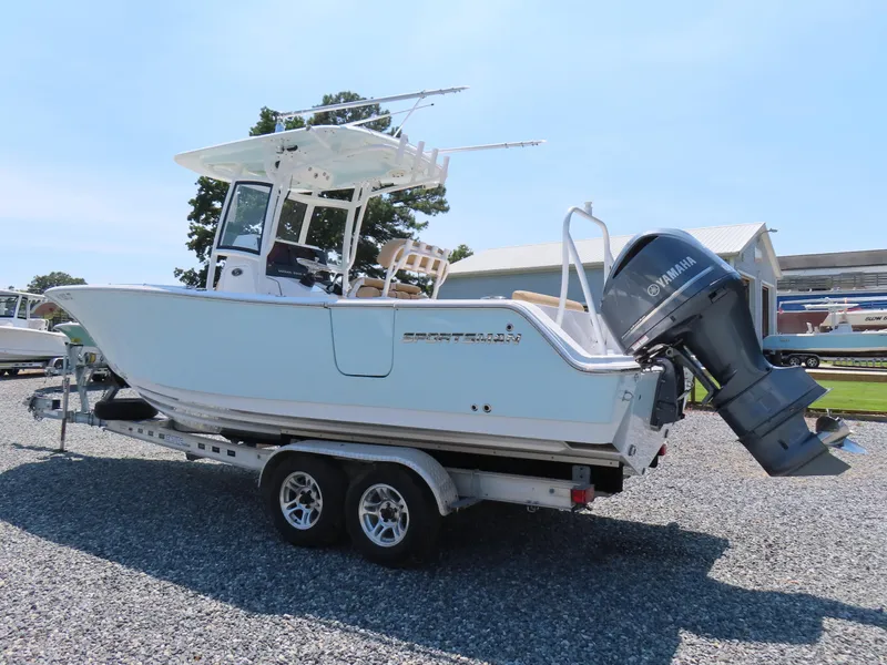 Slide: The Image of 2018 Sportsman Heritage 251 Center Console boat on trailer, featuring Yamaha outboard motor. - 2
