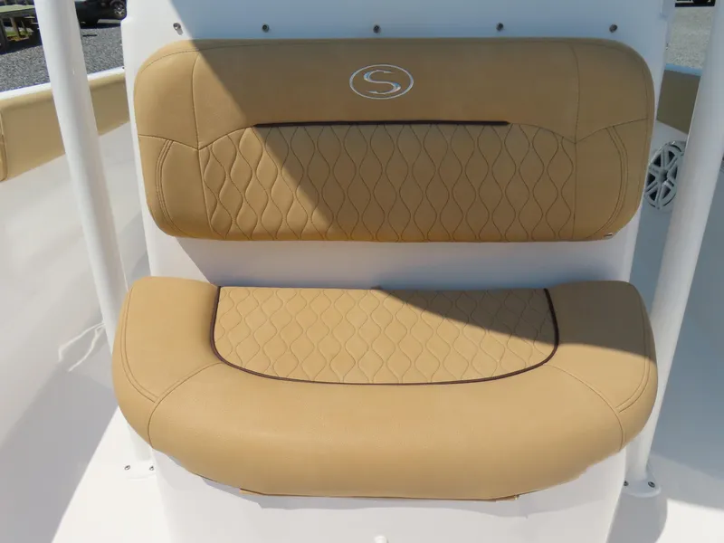 Slide: The Image of Tan cushioned seating on 2018 Sportsman Heritage 251 Center Console boat. - 22