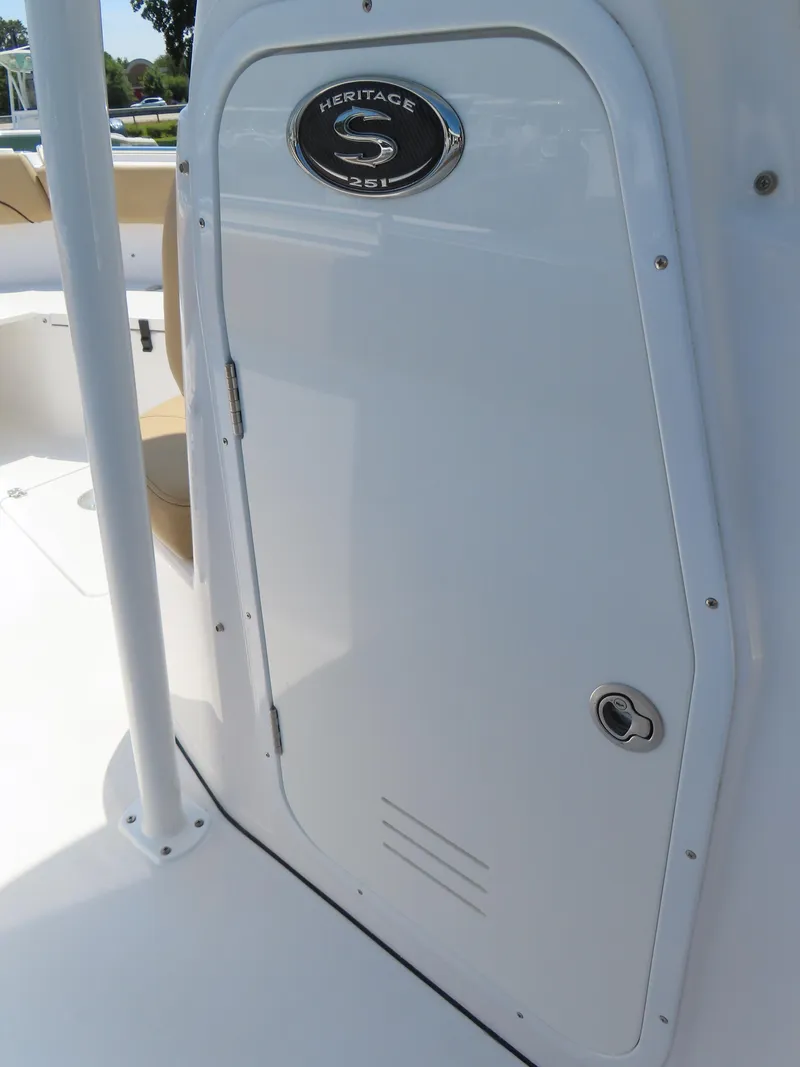 Slide: The Image of 2018 Sportsman Heritage 251 Center Console boat door with logo emblem. - 24