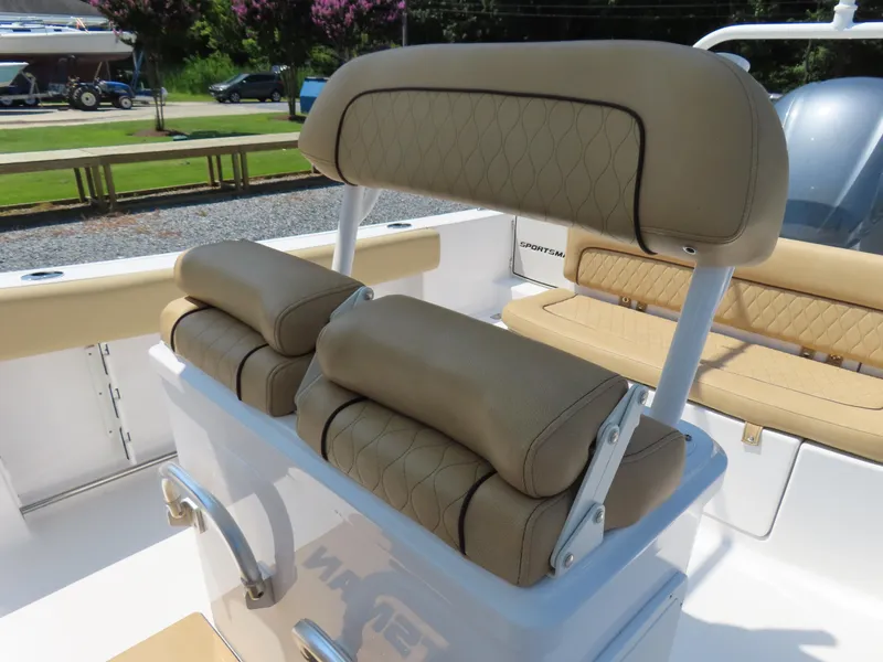 Slide: The Image of 2018 Sportsman Heritage 251 Center Console boat seating with tan upholstery and diamond stitching. - 27