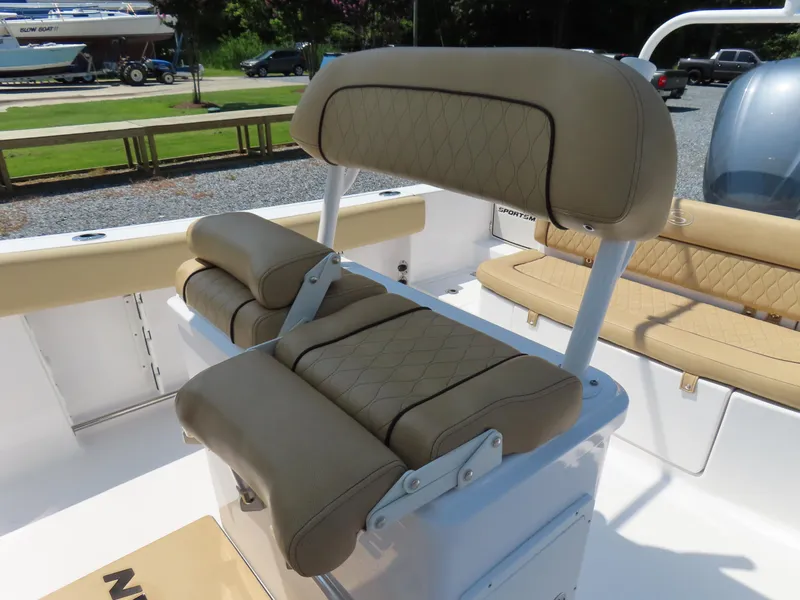 Slide: The Image of 2018 Sportsman Heritage 251 Center Console boat with tan cushioned seating. - 28