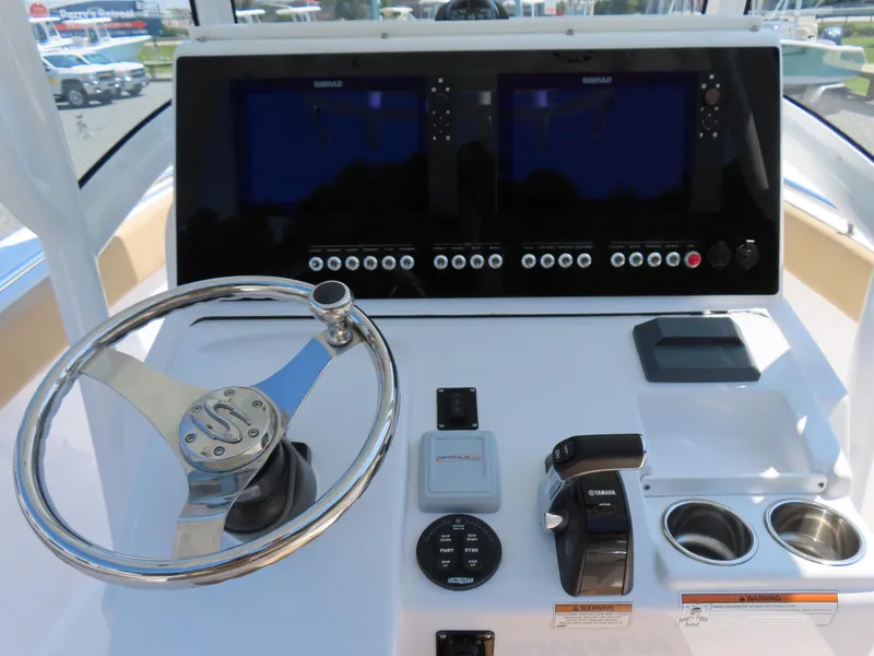 Slide: The Image of 2018 Sportsman Heritage 251 Center Console dashboard with steering wheel and controls. - 29