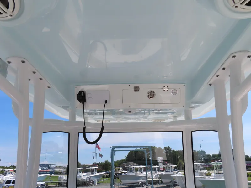 Slide: The Image of 2018 Sportsman Heritage 251 Center Console boat interior with radio and speakers. - 31